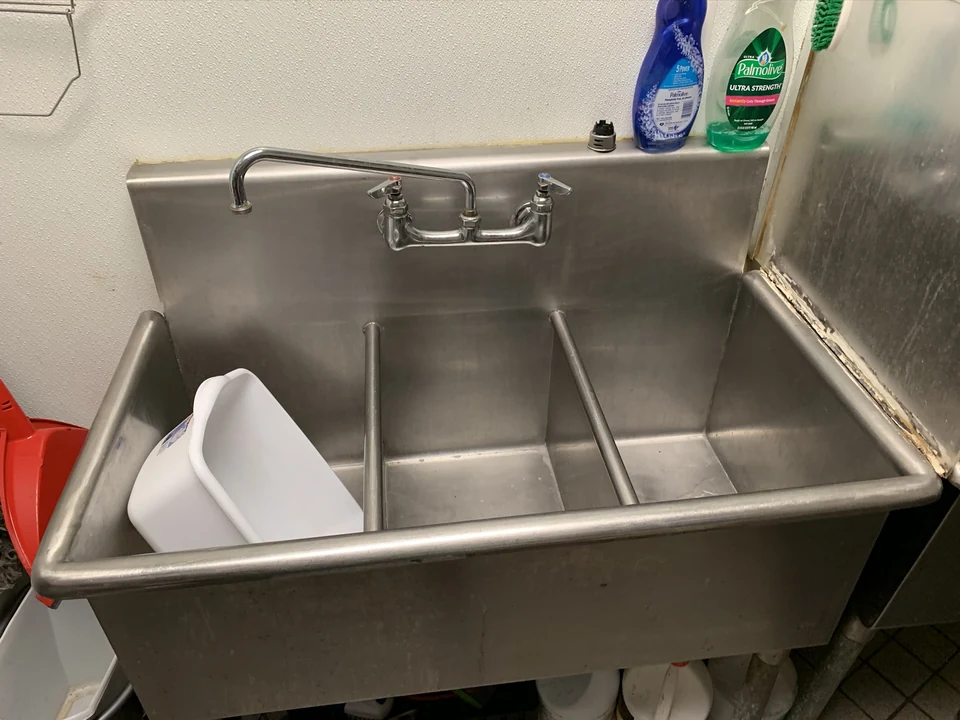 Stainless-steel commercial sink in Beleaf’s work photos