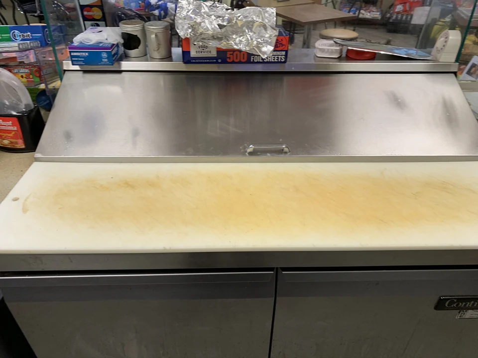 First preparation-station view, with yellow and brown discoloration on the board